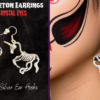 Young woman in red & black sugar skull make up wearing silver unicorn skeleton earrings